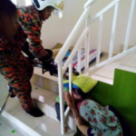 Poor child! One-year-old boy gets his head stuck in stair handrail