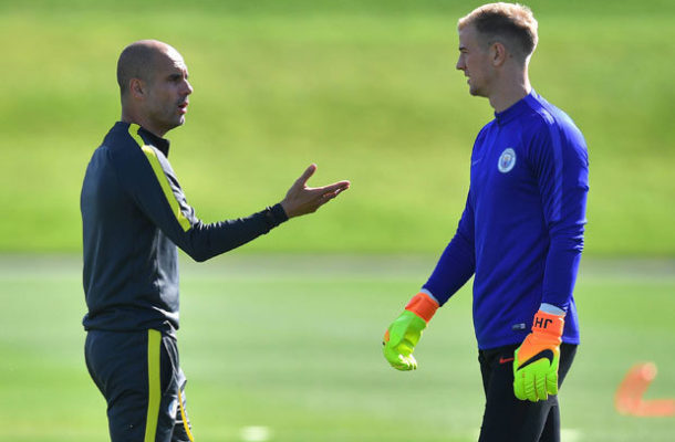 England Goalkeeper JOE HART Locked in a Tense Exchange with Manchester City Boss Pep Guardiola.