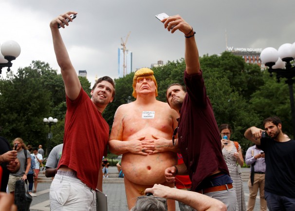 Members of the anarchist collective INDECLINE unveiled life-size statues of Trump in the nude in public spaces in New York, San Francisco, Los Angeles, Cleveland and Seattle. Aug. 18, 2016 A woman points at a statue of a naked Republican presidential candidate Donald Trump in New York’s Union Square Park. Mary Altaffer/AP
