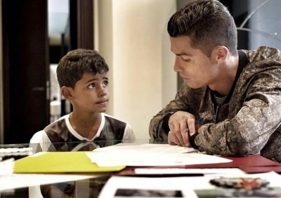 Daddy duties! Ronaldo helps out his son with school homework (Photo)