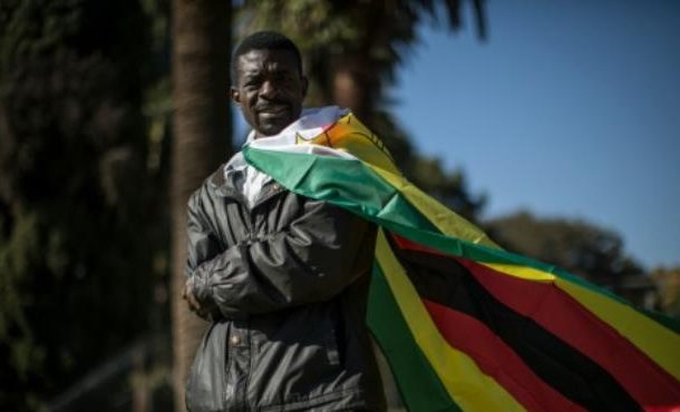 Zimbabwe warns flag 'abusing' protesters