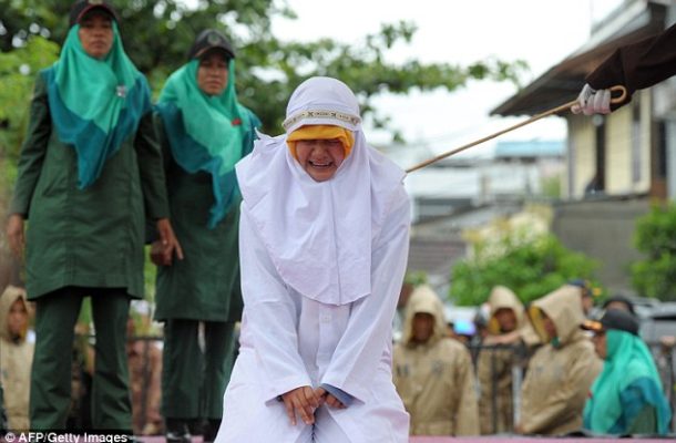 Muslim woman screams out in pain as she is caned 23 times in Indonesia for 'standing too close to her boyfriend'  Read more: http://www.dailymail.co.uk/news/article-3844392/Muslim-woman-screams-pain-caned-23-times-Indonesia-standing-close-boyfriend