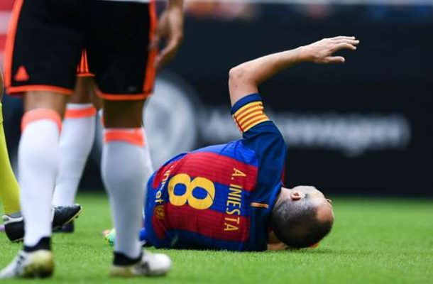 Iniesta in tears after being stretchered off