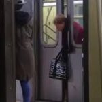Old lady's head gets stuck in subway car and passersby walk by without helping (video)