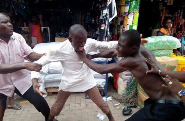 PHOTOS: Greed as two Kumasi street pastors exchange blows over offertory