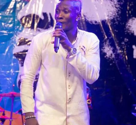 Asamoah Gyan performs as a musician live on stage