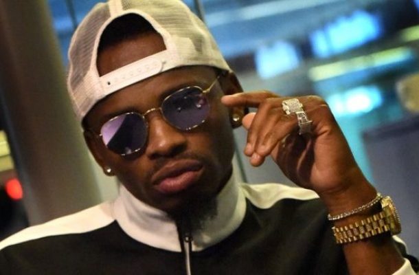 Tanzanian singer, Diamond Platnumz is in trouble for a kiss