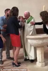 VIDEO: Priest SLAPS baby because it won’t stop crying during baptism
