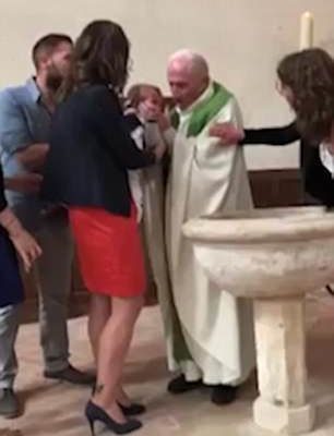 VIDEO: Priest SLAPS baby because it won’t stop crying during baptism