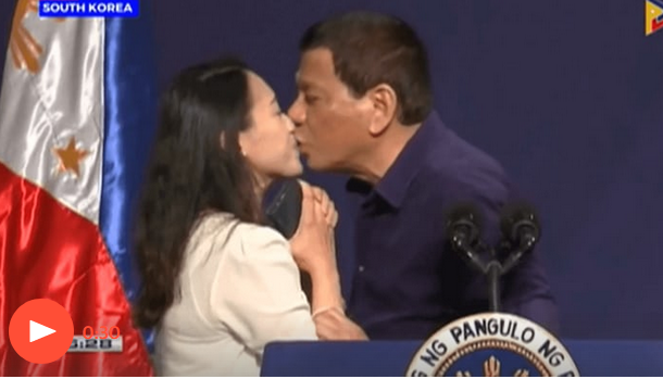Philippine president criticized for kissing woman on stage