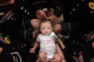 TOUCHING: Colleagues of soldier who died at battle unite for photoshoot with his baby