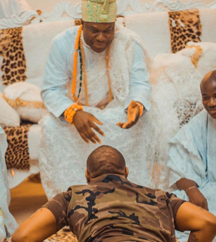 PHOTOS: Davido goes flat on the ground as he pays courtesy visit to Yoruba chief