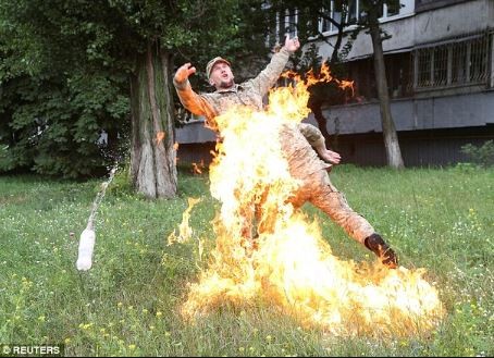 SHOCKING PHOTOS: Soldier sets himself on fire to protest after he was sacked