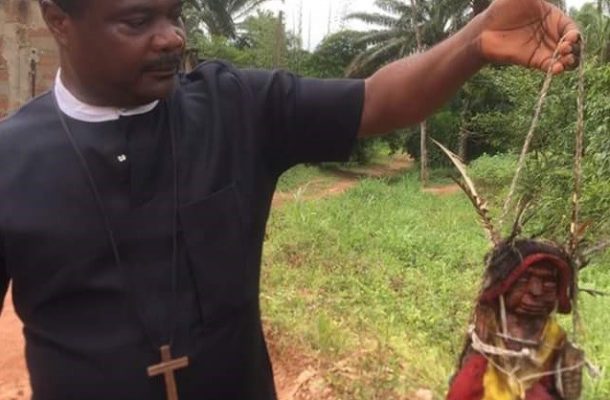 SHOCKING PHOTOS: Pastor shows off evil deity he physically 'defeated' inside a devilish shrine