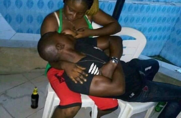 SHOCKING PHOTO: Man gets "drunk" on breast milk while at a bar with his girlfriend