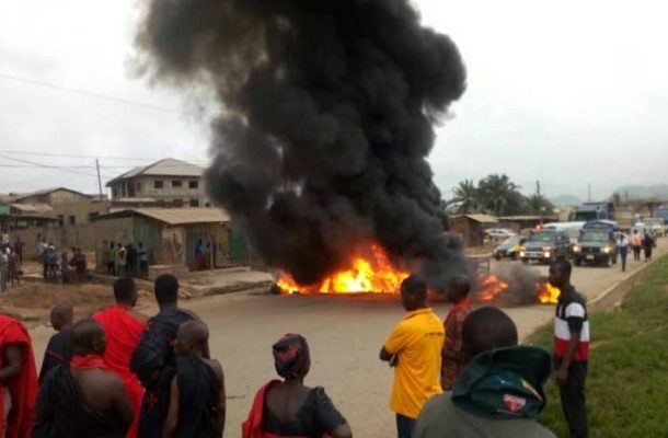 PHOTOS: Tarkwa chiefs burn tyres over deplorable state of roads