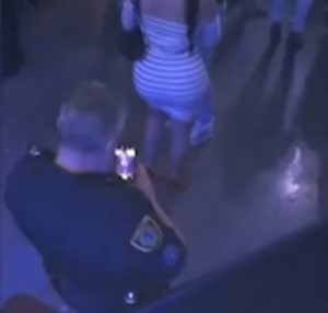 PHOTOS/VIDEO: Policeman hot after he was caught taking photo of woman's buttocks at concert