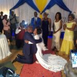 TOUCHING PHOTOS: Man kneels down to kiss his Dwarf-like Lover on their wedding day