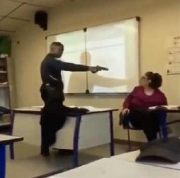 VIDEOS: Student points a gun at his teacher and forces her to change his grades