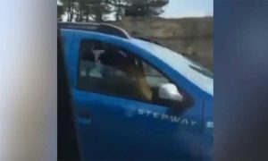 VIDEO: Shocking moment couple are caught having sex while driving down the middle lane of a motorway