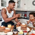 PHOTOS: Anthony Joshua and his son, JJ cover the December edition of GQ Magazine