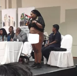 PHOTOS: Rape victim strips naked in public to show South Africa president scar inflicted by rapists
