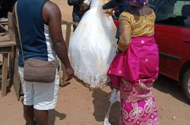 VIDEO: Drama as first wife storms wedding venue; pours palm oil on husband's new bride's wedding gown