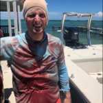 VIDEO: Shocking moment a man was bitten on the head by a shark but he survives