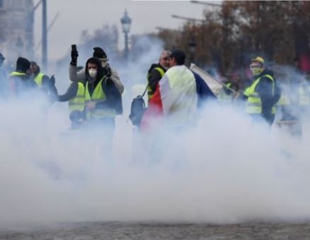 100 people arrested, 80 injured as French police clash with fuel tax protesters in Paris