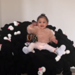 Check out 11-month-old Stormi Webster rocking the $1,100 LV bag her aunt Kim Kardashian bought for her
