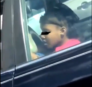VIDEO: Little girl causes stir after she was caught on camera practicing erotic scenes inside a car