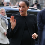 PHOTOS: Meghan Markle steps out looking regal in a sleek topknot and an all-black outfit