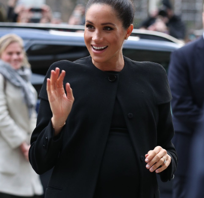 PHOTOS: Meghan Markle steps out looking regal in a sleek topknot and an all-black outfit