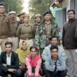 Indian guards pose with Rohingya family, then deport it