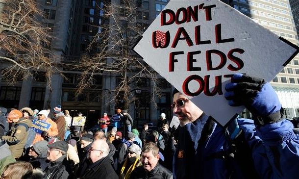 US federal workers miss paycheck over govt. shutdown