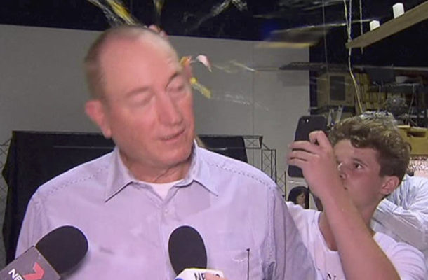 Teenager Cracks an Egg on Australian Senator's Head (VIDEO)