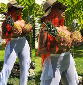 Rapper Dream Doll poses topless, uses Pineapples to cover her boobs in raunchy new photos