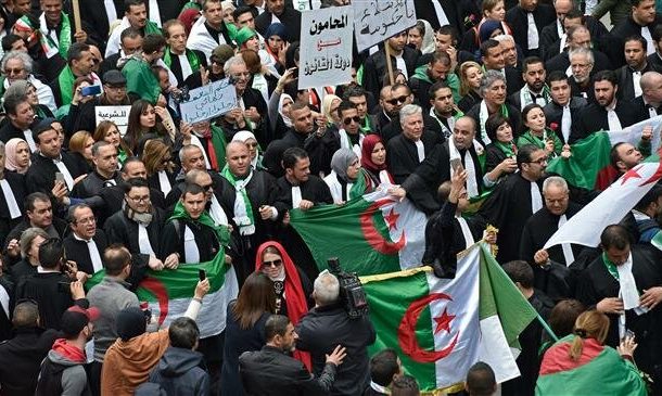 Hundreds of Algerians battle rain to protest Bouteflika