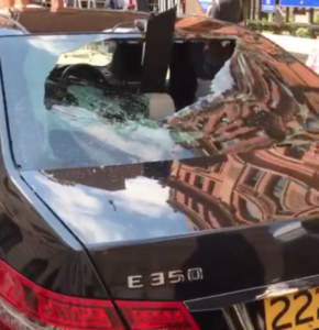 VIDEO: Nigerian man goes on rampage; destroys luxurious cars at UK High Commission