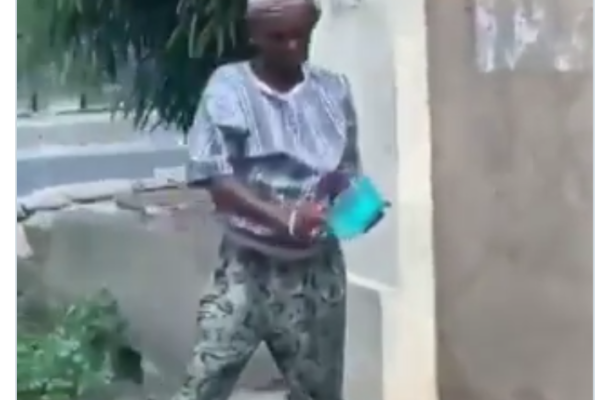 SHOCKING VIDEO: Woman caught washing plates by the roadside with 'gutter' water