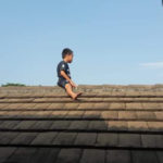 PHOTO: Little boy scared of getting circumcised climbed up a roof ; refuses to come down after 3 hours