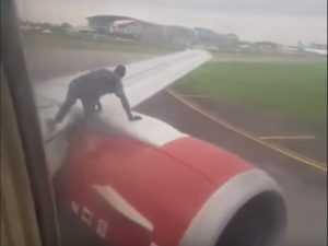 VIDEO: Man climbs onto the wing of a moving plane
