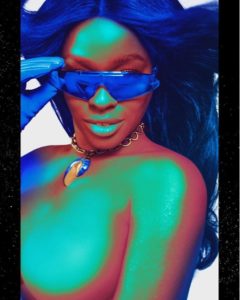 Azealia Banks exposes her boobs as she goes topless in provocative photos