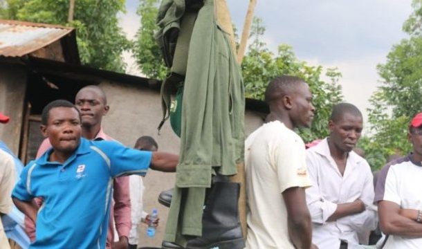 Kenya officials exhume man's body to retrieve uniform