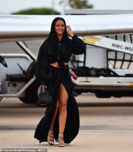 PHOTOS: Rihanna flaunts hot legs in sexy thigh-high split skirt as she touches down in Barbados