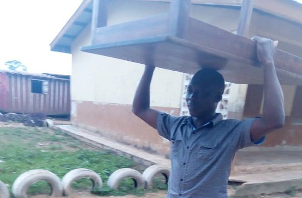 ENCHI: NDC chairman hailed for carrying a table on his head after primaries