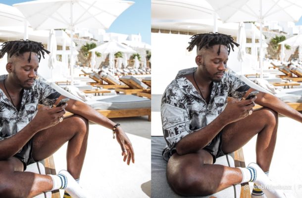 Mr Eazi SAVAGELY responds to troll who asked of the sponsor of his expensive summer trip