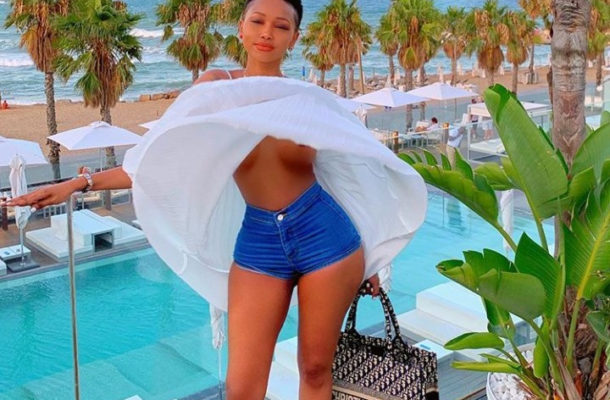 Huddah Monroe's boobs exposed as the wind lifted her top while she posed for a photo