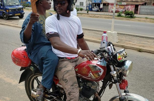 TOUCHING PHOTO: Physically challenged man hires 'okada' to join Ghanaian Muslim ladies protest