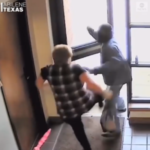 VIDEO: Elderly woman hailed after she was filmed bravely fighting off an armed bank robber